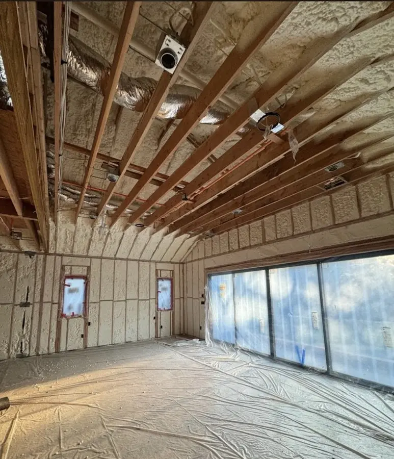 Interior walls and ceiling insulated with spray foam during new construction in Long Beach